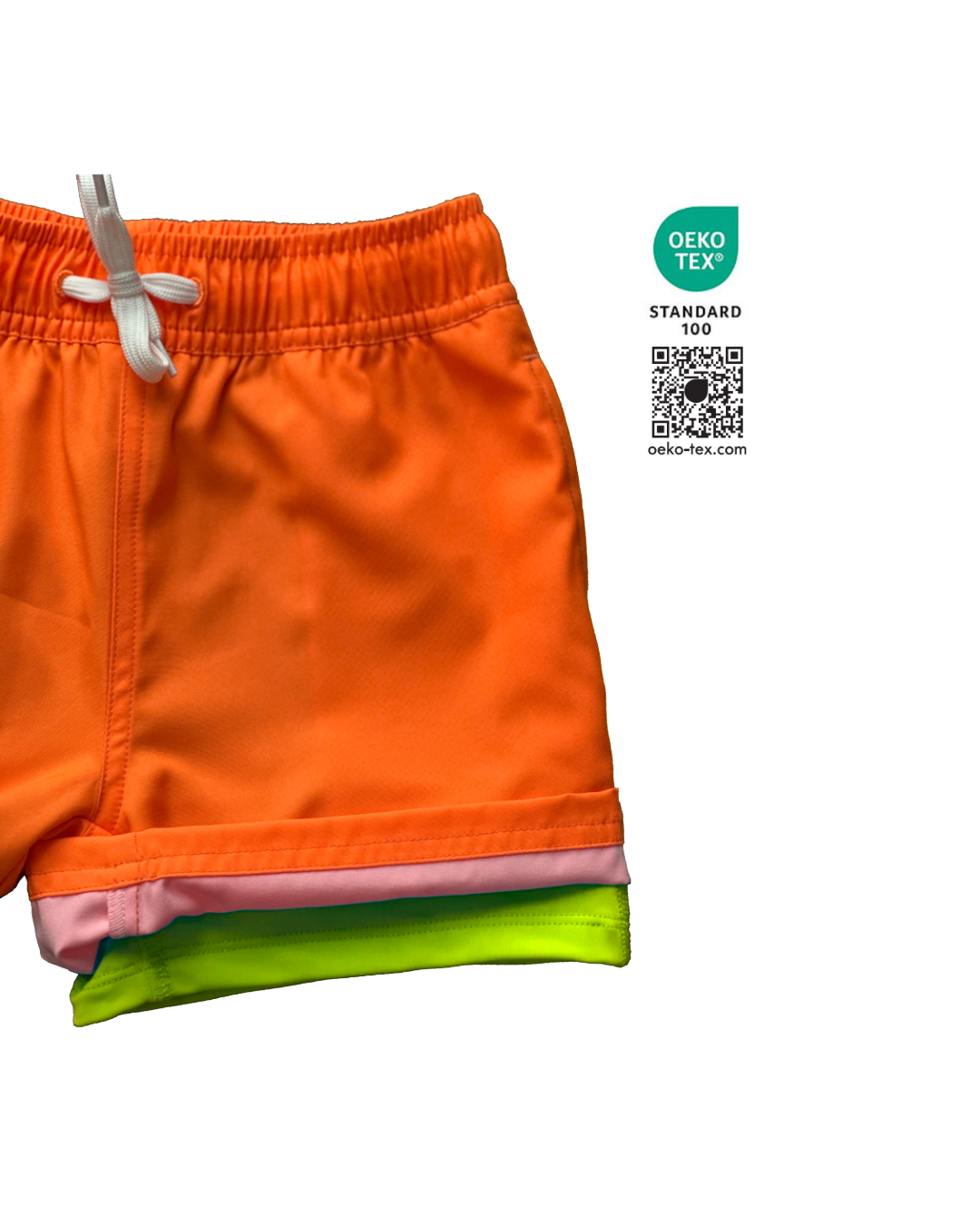 Boys bright neon orange swim shorts with neon yellow boxer brief liner for anti-chaff comfort, quick drying,  with a functional drawstring and a full waist elastic band and reinforced pockets. The neon orange boys hybrid swim trunks stand out against any background.